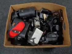 A box of vintage and later cameras, cased binoculars,