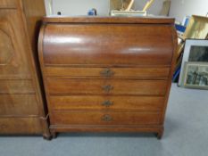 A nineteenth century oak cylinder bureau