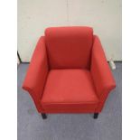 A red upholstered armchair