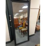 A black framed contemporary overmantel mirror