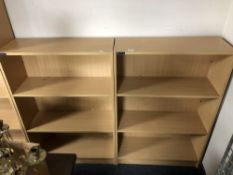 Two sets of pine effect open bookshelves,
