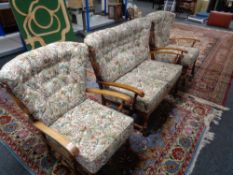 A three piece wood framed cottage lounge suite in tapestry fabric