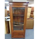 A mahogany glazed door display cabinet