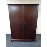 A Stag Minstrel double door wardrobe and a 5' headboard