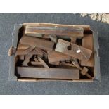 A box of vintage wooden wood planes
