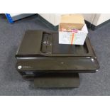 An HP office jet 7612 multi function printer and a box of ink cartridges