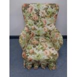 A continental armchair in floral upholstery