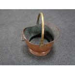 A Victorian copper and brass handled coal bucket