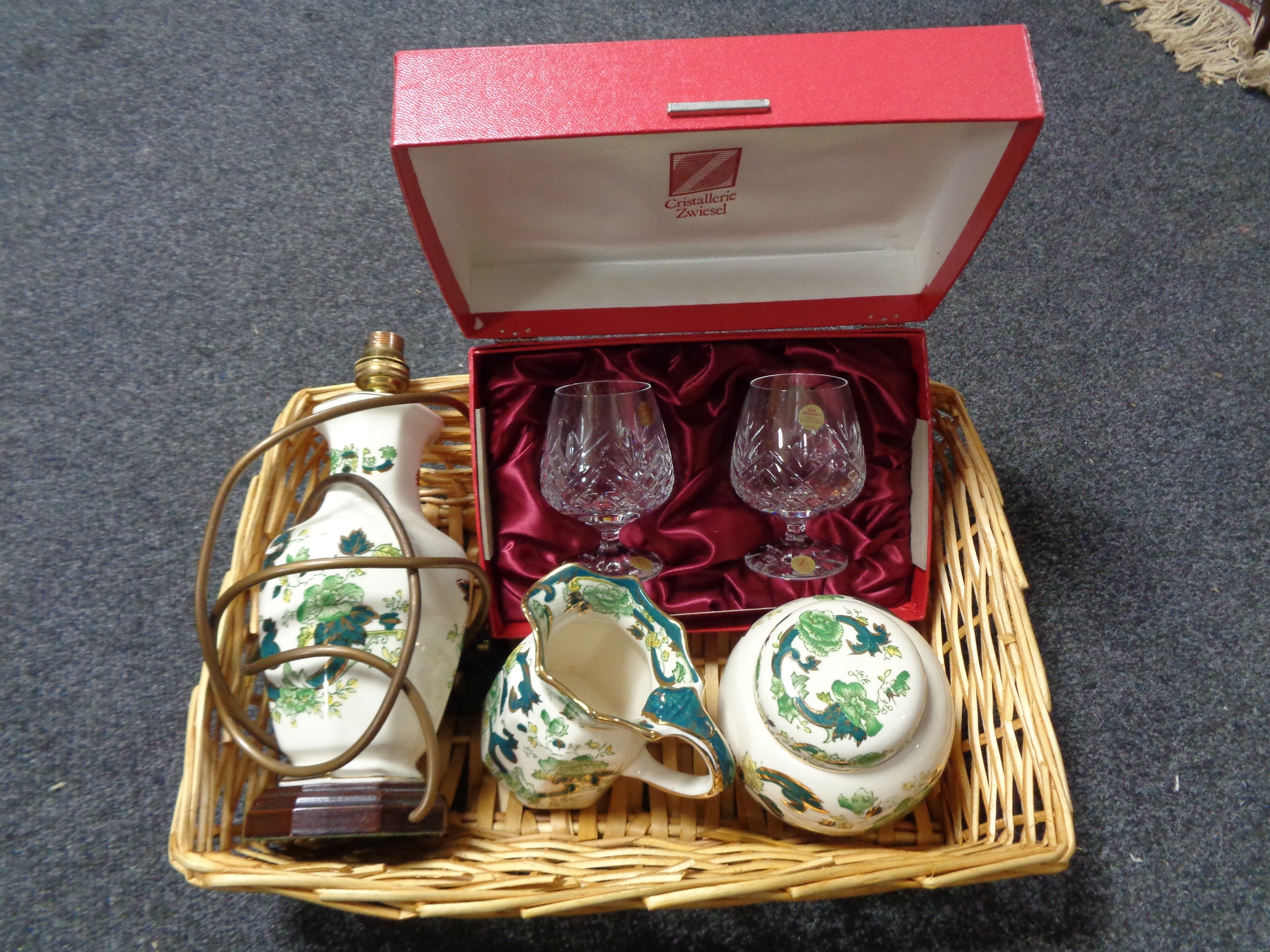 A wicker basket of Masons Chartreuse china,