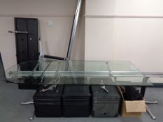 A contemporary glass topped modular office desk fitted with drawers