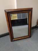 A nineteenth century walnut and ebonised wall mirror