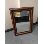 A nineteenth century walnut and ebonised wall mirror