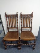 A pair of Edwardian oak dining chairs