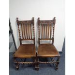 A pair of Edwardian oak dining chairs