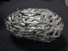 A piece of contemporary metal art - fishes