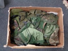 A box of army surplus clothing,