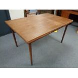 A mid century Danish teak pull out table