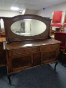 An Edwardian oak mirror backed sideboard