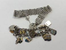 A silver padlock bracelet and another enamelled silver bracelet