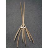 Two rustic hay forks