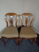A pair of walnut dining room chairs