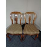 A pair of walnut dining room chairs