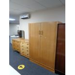 A three piece mid 20th century G Plan bedroom suite comprising double wardrobe,