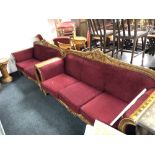 A Syrian ornate two seater and three seater scroll arm settees upholstered in red fabric