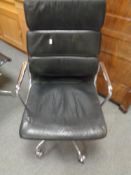 A Vitra Charles Eames designed soft pad executive swivel office chair upholstered in black leather