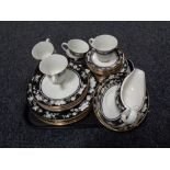 A tray of thirty-three pieces of Royal Doulton Intrigue tea and dinner service