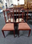 A set of four Edwardian Arts & Crafts dining chairs