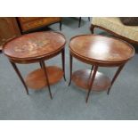 A pair of inlaid mahogany oval occasional tables
