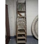 Two sets of folding wooden steps