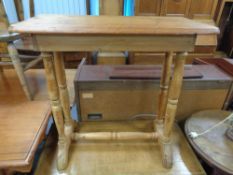 A nineteenth century pine side table