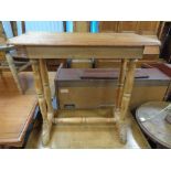 A nineteenth century pine side table