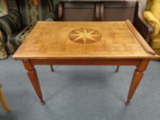 A beech parquetry inlaid table