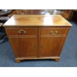 A double door TV cabinet in the form of a sideboard by R.