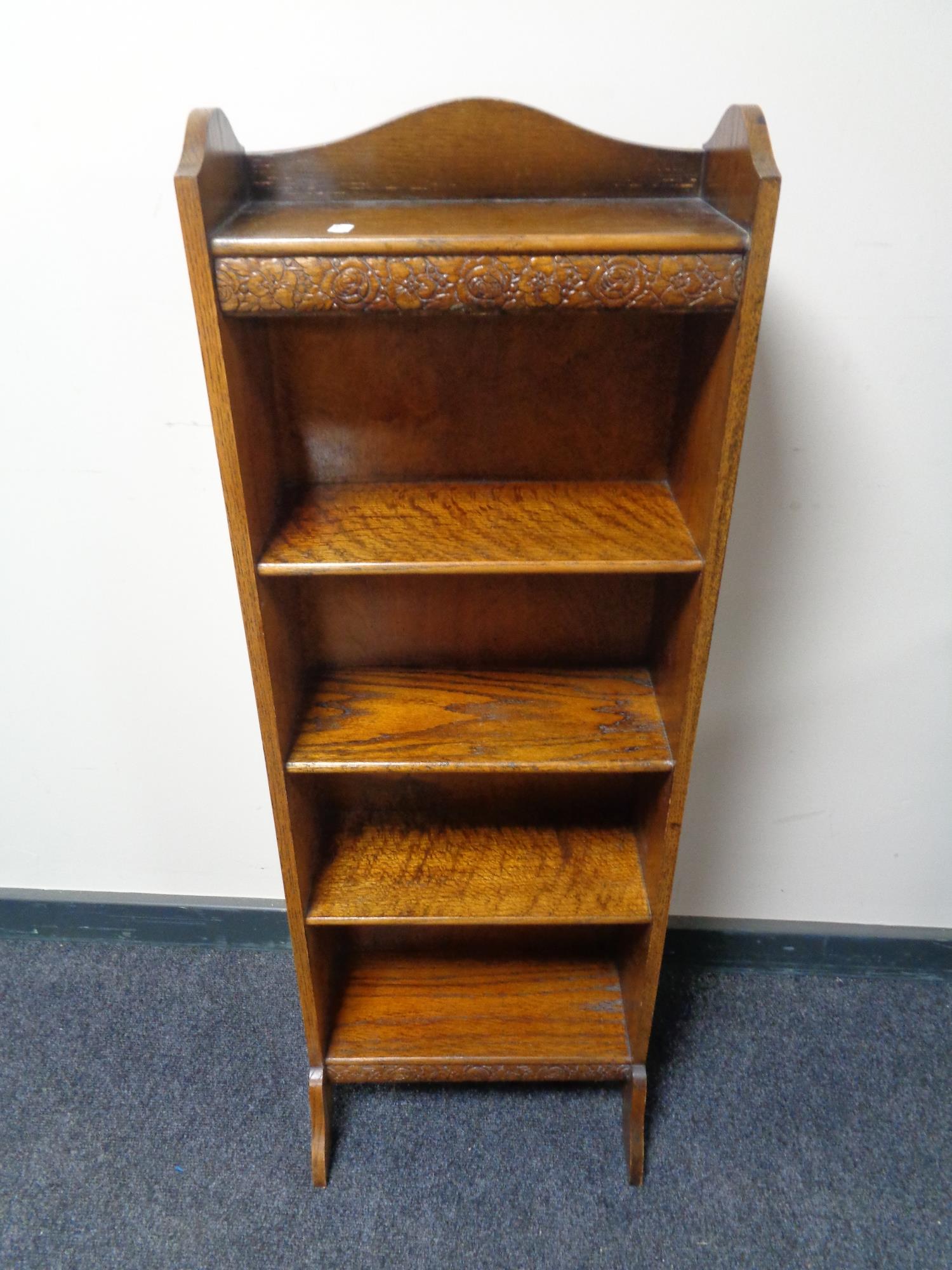 A set of narrow oak open shelves