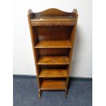 A set of narrow oak open shelves