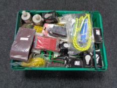 A crate of tools, bungee cord, socket adapter, palm sander,