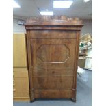 A nineteenth century continental mahogany secretaire cabinet