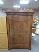 A nineteenth century continental mahogany secretaire cabinet