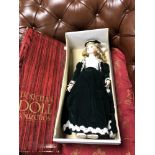 A boxed porcelain collection doll