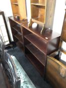 A pair of open shelves in a mahogany finish