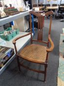 An inlaid mahogany bergere seated armchair