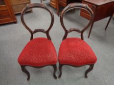 A pair of nineteenth century mahogany baloon backed dining chairs