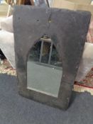 A slate framed arched topped mirror