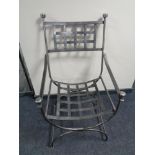 A wrought iron armchair