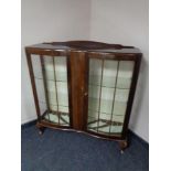 A mid 20th century walnut display cabinet