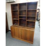 A mid century Danish sliding door bookcase